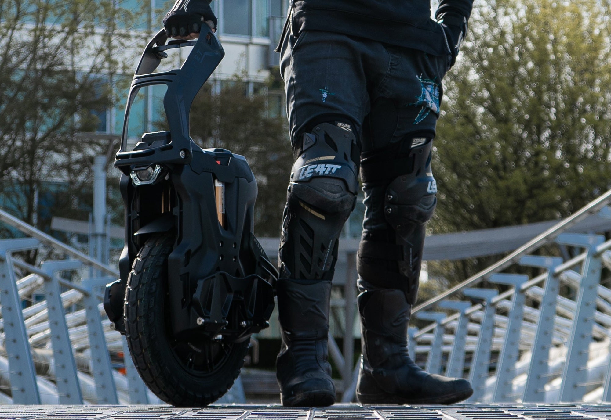 Person using a self-balancing scooter on a metal staircase