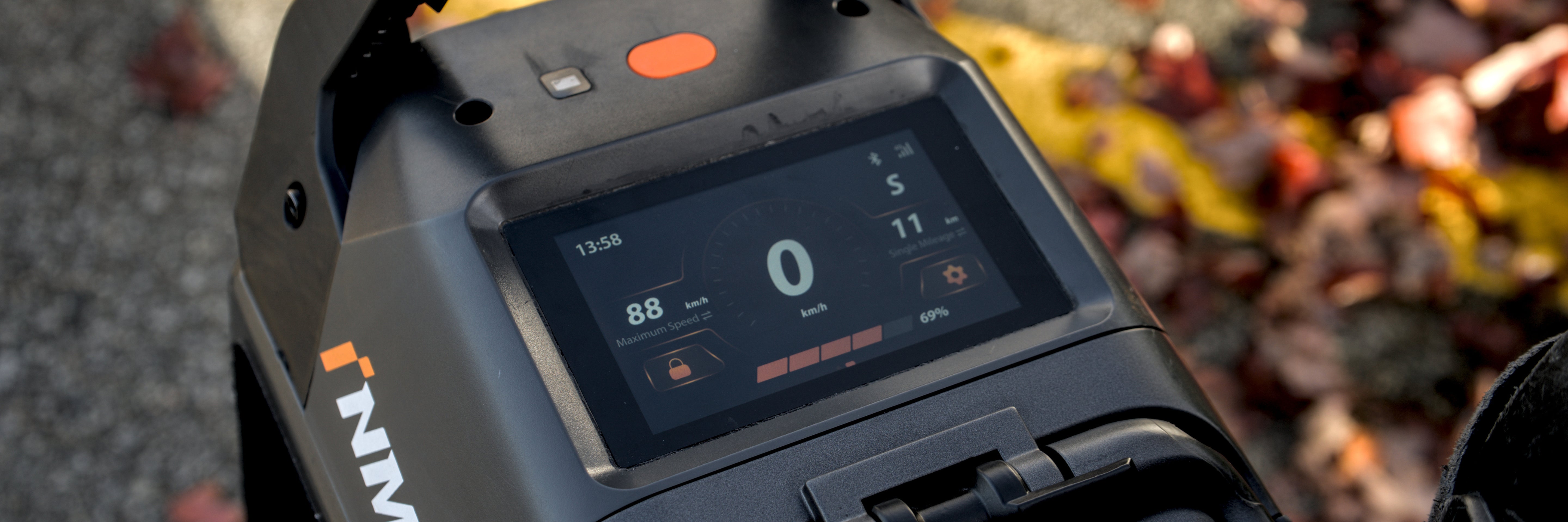 Close-up of a device with a digital display and 'MAX' branding, blurred background